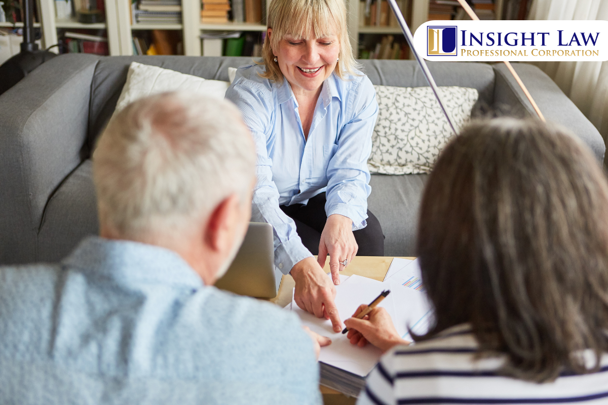 Ontario lawyer explaining the difference between a power of attorney and a will to a client reviewing estate planning documents